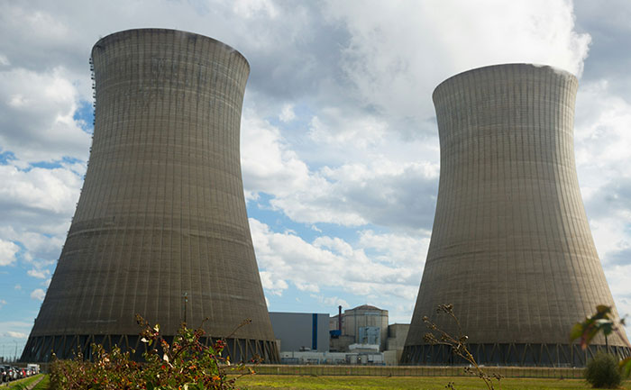 Cooling towers under cloudy sky, representing a major flop.