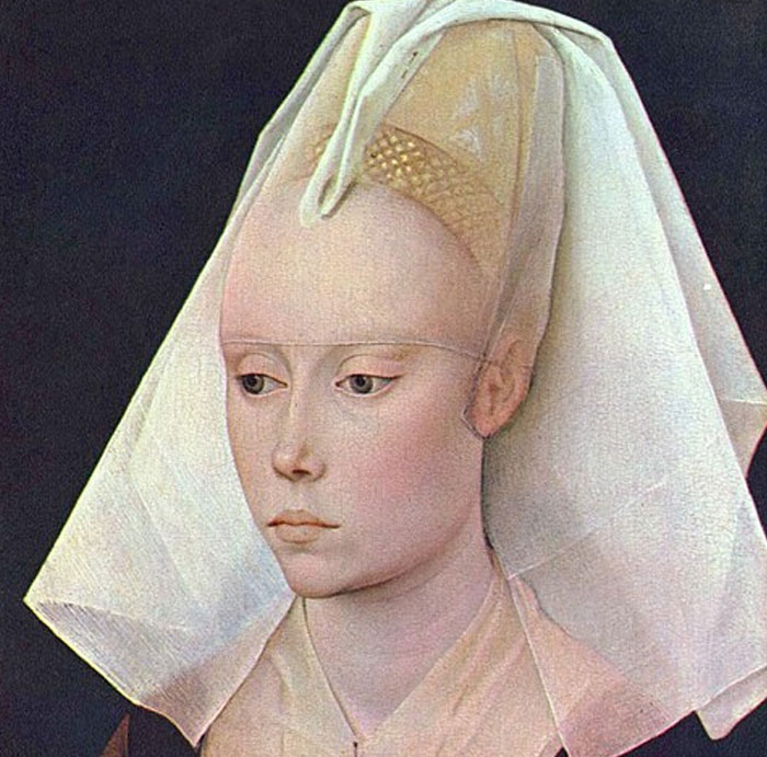 Medieval woman with a tall headdress, illustrating normal medieval attire that seems strange today.