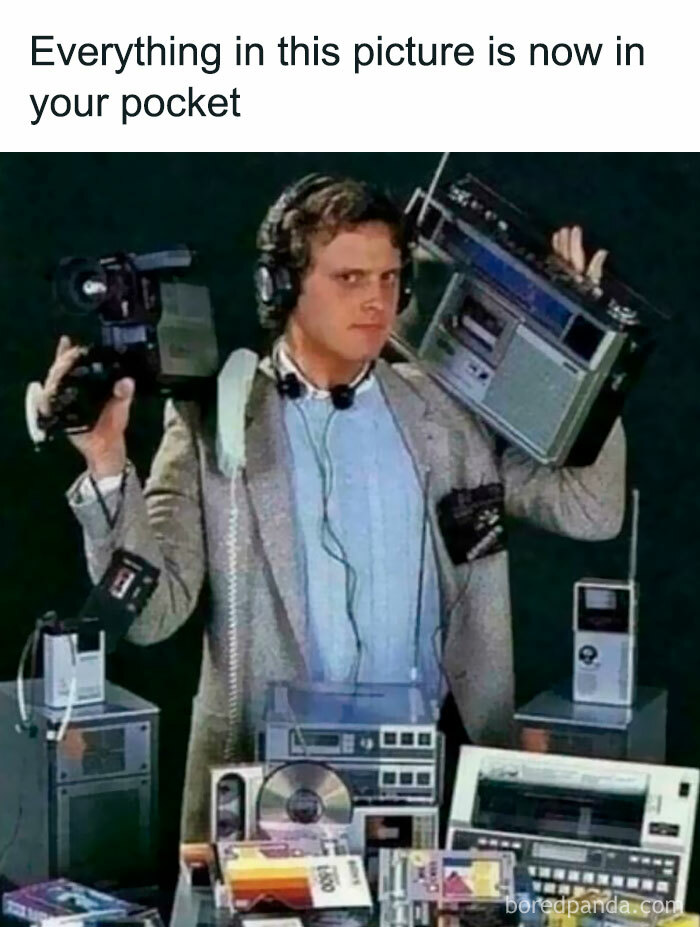 Man holding retro tech items, highlighting devices that now fit in a pocket, evoking nostalgia without trying.