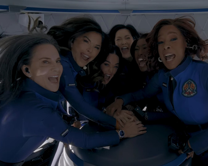 Crew members in blue uniforms inside a Blue Origin capsule, hands together, sparking conspiracy theories about a "fake" hand. Crew members in blue uniforms inside a Blue Origin capsule, hands together, sparking conspiracy theories about a "fake" hand.