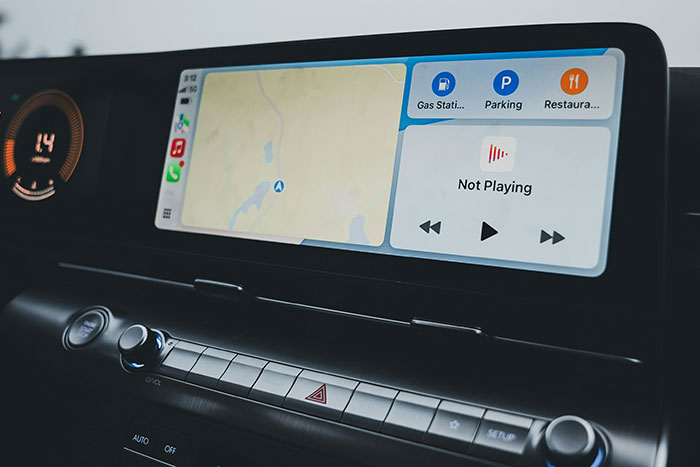 Car dashboard displaying a navigation screen and media controls, illustrating a topic boomers might be right about.