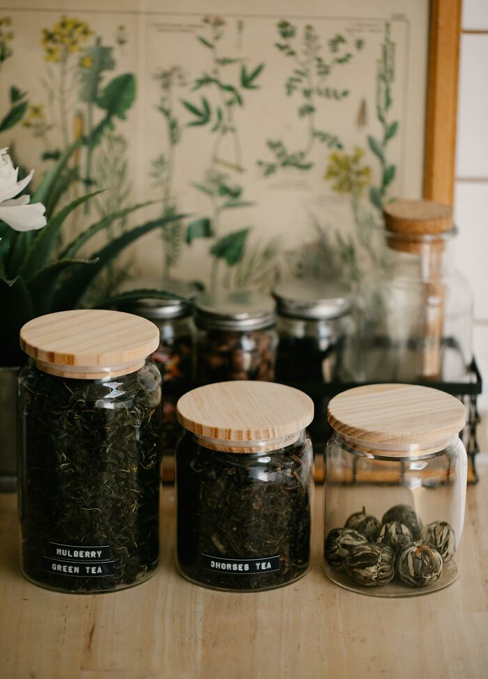 Three glass jars with wooden lids containing different teas, representing obvious things you've just become aware of.