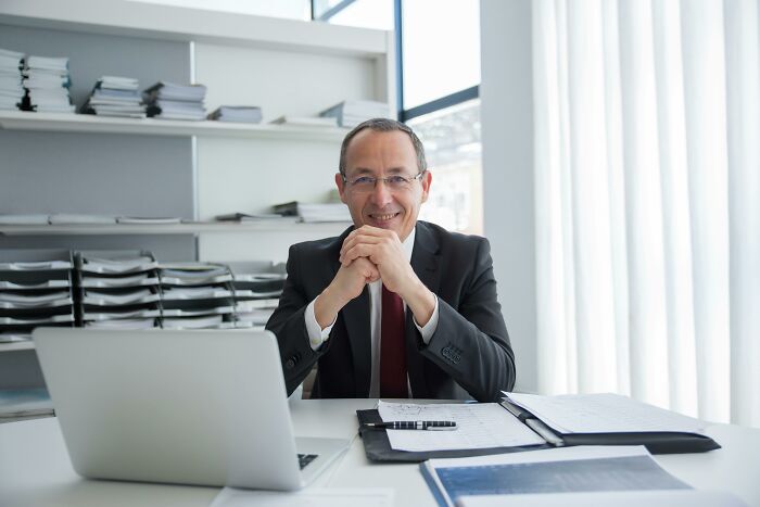 Man in an office with a laptop, illustrating biggest red flag job interview setting.