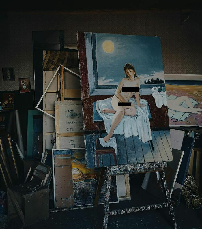 Creepy painting of a n**e figure on an easel in a cluttered room, evoking an unsettling atmosphere.
