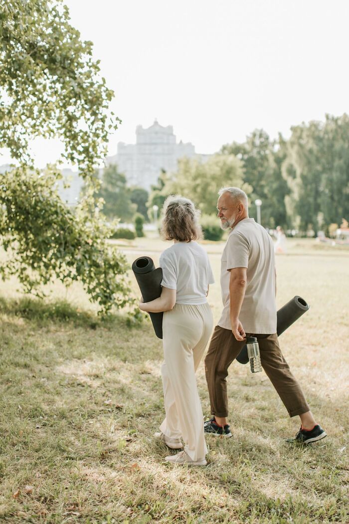 Older couple outdoors with yoga mats, representing Americans who’ve moved abroad permanently for a peaceful lifestyle.