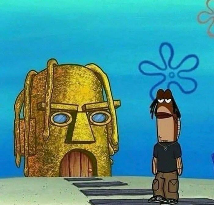 Cartoon fish character standing beside a tiki-inspired house, creating a funny meme scene.