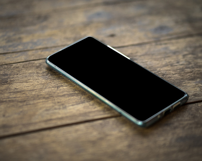 A deactivated phone rests on a wooden surface, related to the Utah woman found alive after going missing. A deactivated phone rests on a wooden surface, related to the Utah woman found alive after going missing.