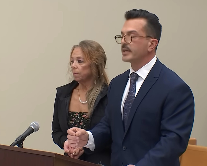 Man and woman at a podium, related to disturbing horror house case discovery.