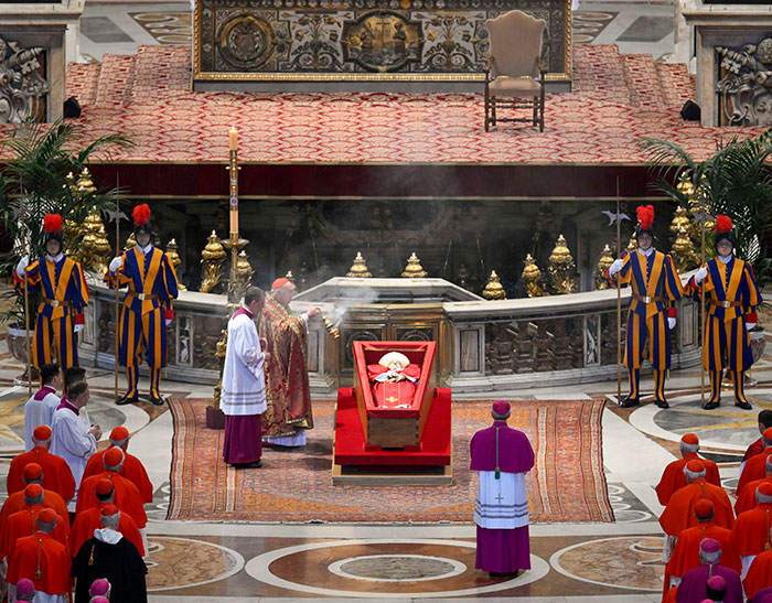 Mourners gathered at the Pope's funeral, attended by Prince William.