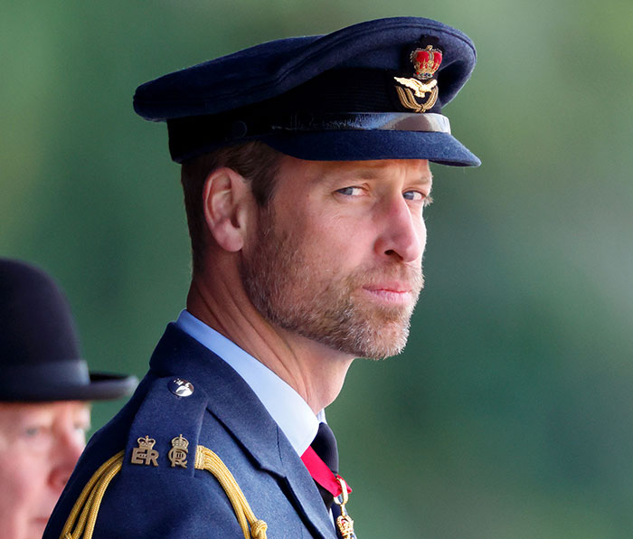 Prince William in military uniform, wearing a hat, attending an event in place of King Charles at the Pope's funeral.
