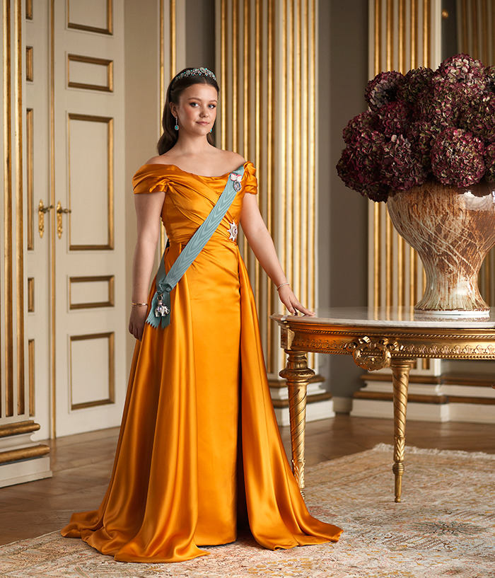 Royal princess in elegant gown, posing in a lavish room with a table, dividing the internet with a silly twist.