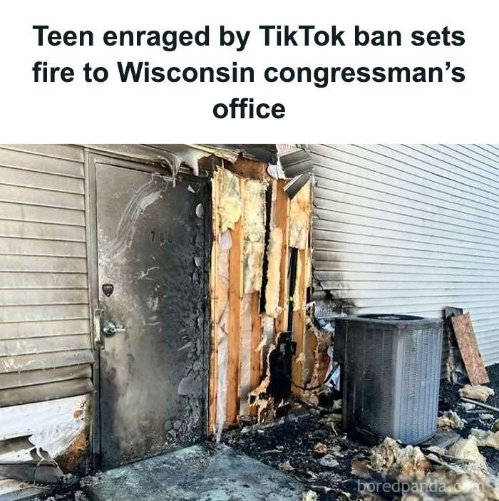 Burned exterior of Wisconsin congressman's office after a fire, showing damaged siding and soot-covered door.