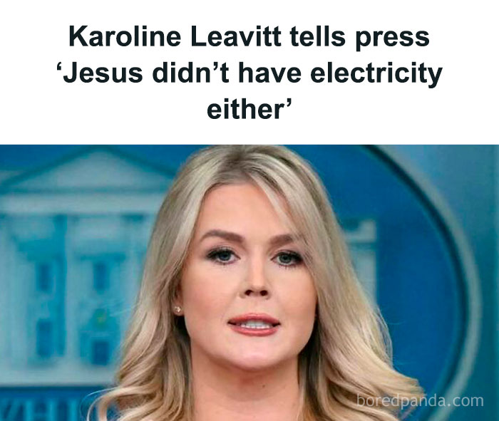 A person speaking at a press event in front of a backdrop with the headline mentioning electricity.