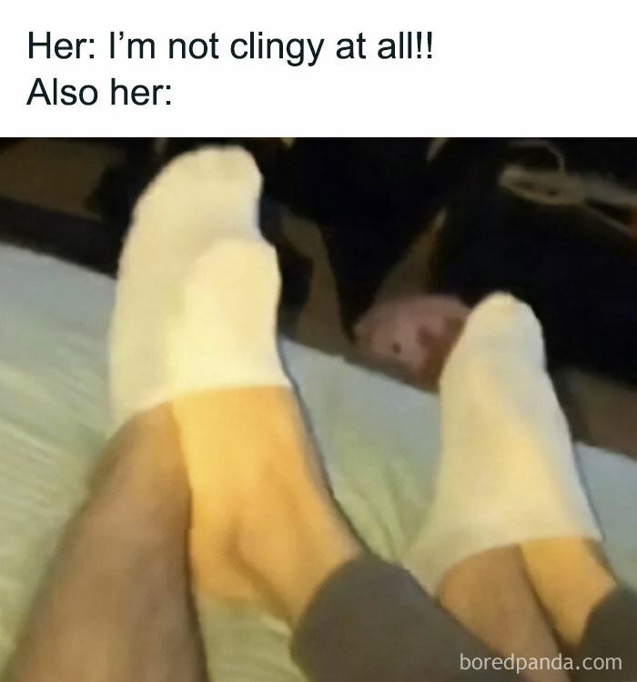 Two pairs of feet wearing white socks, humorously illustrating a relatable clinginess scenario.