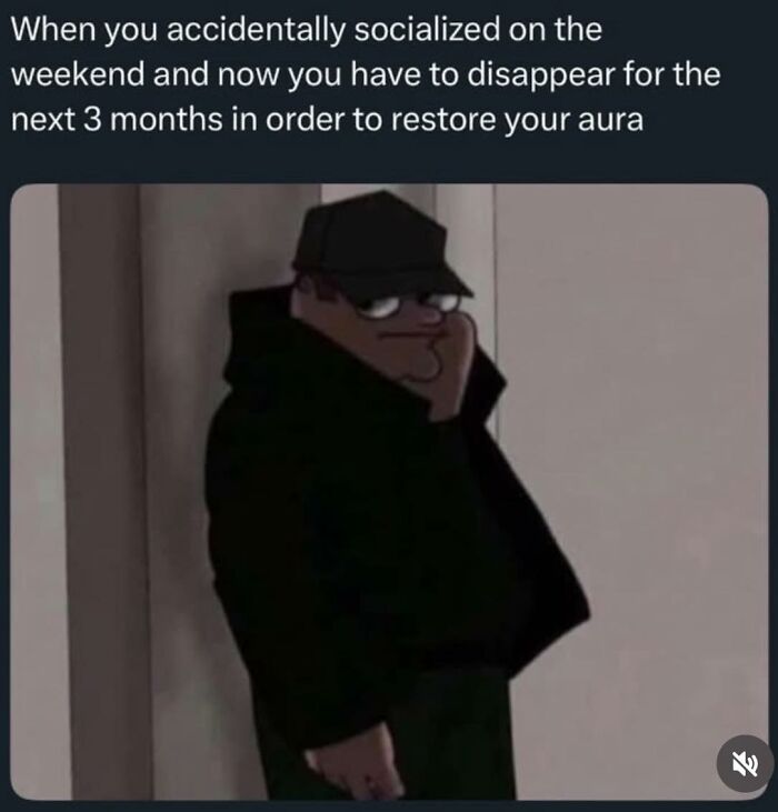 Cartoon character in dark clothing leaning against wall, capturing introverts' socially exhausted feelings.