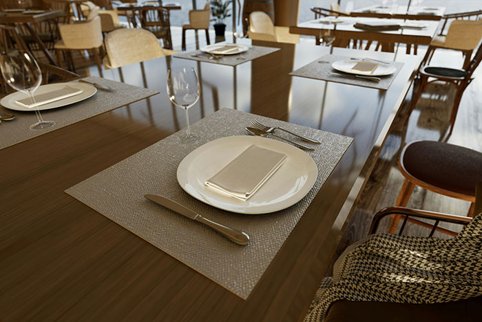 Empty restaurant table setting with napkin and silverware reflecting things from restaurants that don't exist today.