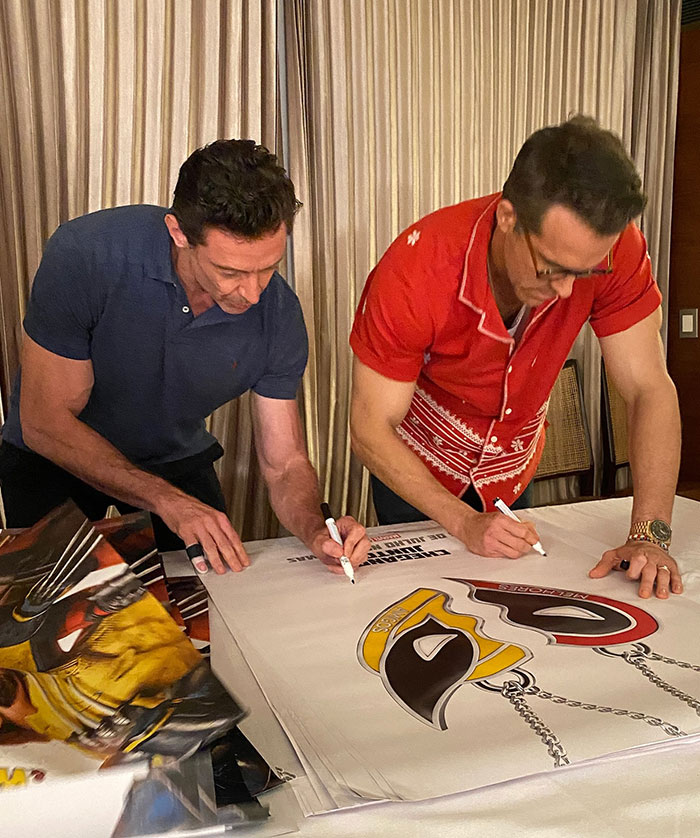 Hugh Jackman and Ryan Reynolds signing posters together, as fans urge Hugh Jackman to stay away from Ryan Reynolds and Blake Lively. Hugh Jackman and Ryan Reynolds signing posters together, as fans urge Hugh Jackman to stay away from Ryan Reynolds and Blake Lively.