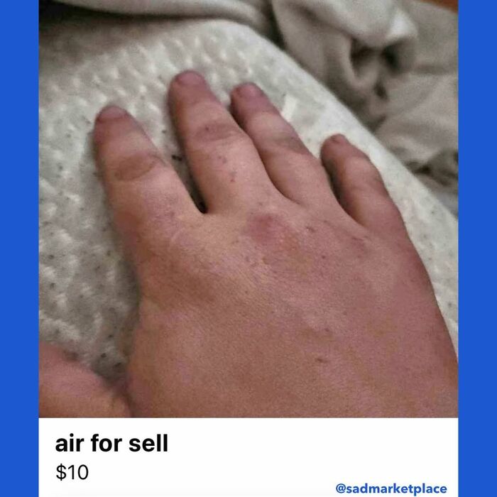 Hand resting on a surface beside text listing "air for sell $10," showcasing a random Facebook Marketplace listing.
