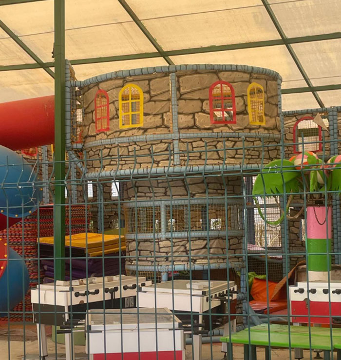 Indoor playground area in a 5-star resort in Turkey, featuring colorful slides and a castle-themed structure. Indoor playground area in a 5-star resort in Turkey, featuring colorful slides and a castle-themed structure.