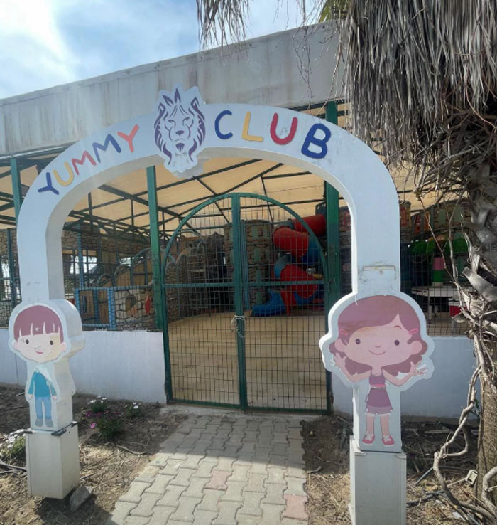 Entrance to children's area at a 5-star resort in Turkey named "Yummy Club" with cartoon characters. Entrance to children's area at a 5-star resort in Turkey named "Yummy Club" with cartoon characters.