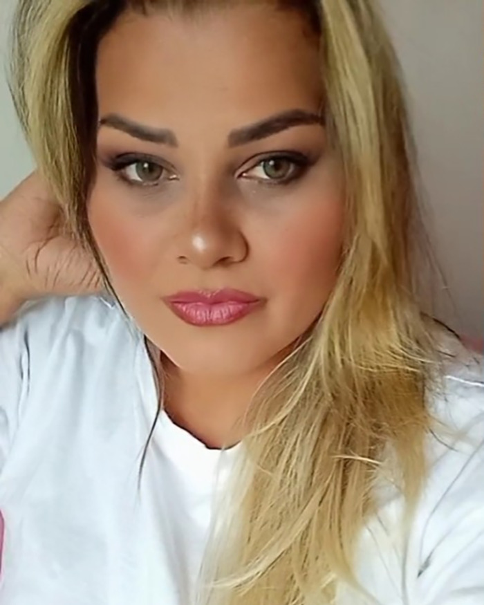 Portrait of a woman involved in the "poisoned Easter gifts" incident, wearing a white shirt and looking directly forward. Portrait of a woman involved in the "poisoned Easter gifts" incident, wearing a white shirt and looking directly forward.