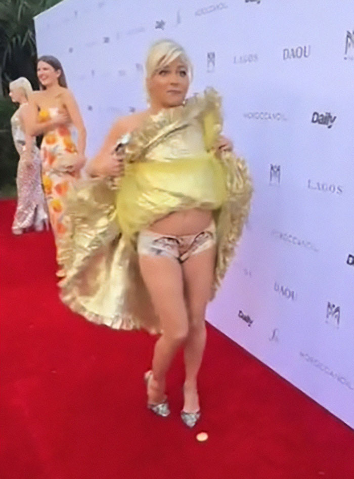 Selma Blair showing personality in a golden outfit and kitten-themed panties on the red carpet. Selma Blair showing personality in a golden outfit and kitten-themed panties on the red carpet.