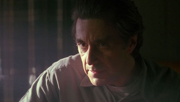 Actor portraying a difficult role with intense expression, showcasing dedication actors went above and beyond for difficult roles.