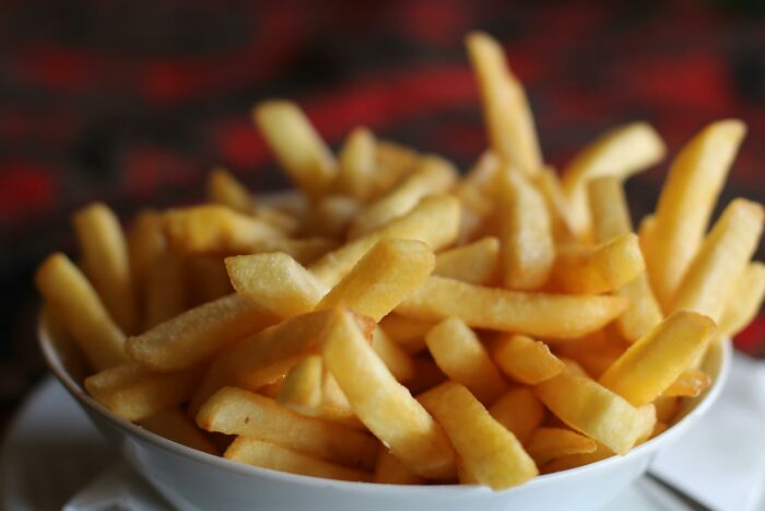 A bowl of crispy French fries, illustrating surprisingly legal behaviors.