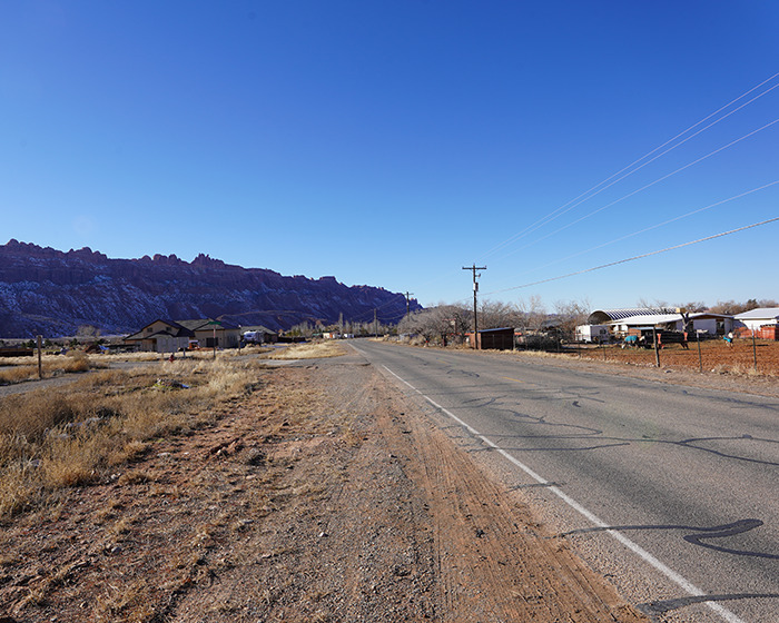 Utah landscape with a rural road and mountains, related to a missing woman found alive. Utah landscape with a rural road and mountains, related to a missing woman found alive.