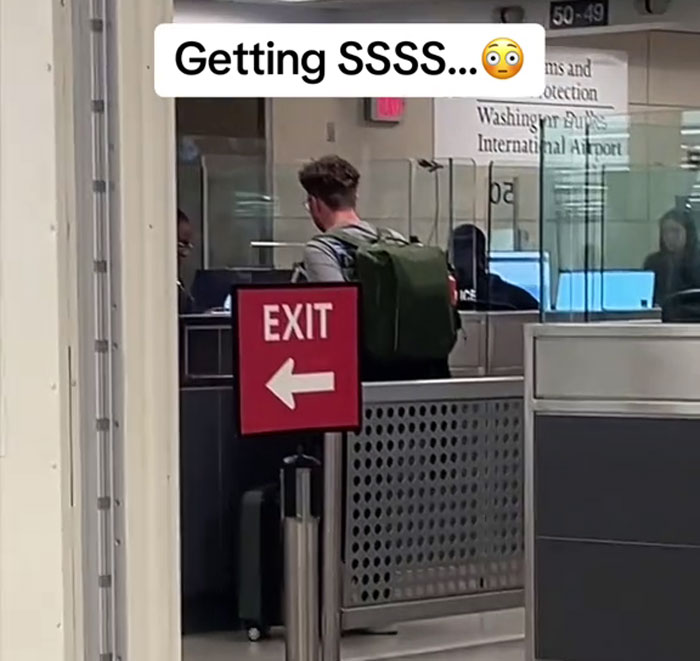 Person at airport security after receiving SSSS code, indicating potential flight issues. Person at airport security after receiving SSSS code, indicating potential flight issues.