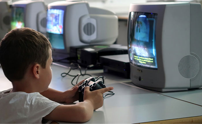 A child playing a game on an old TV, highlighting a crazy coincidence in technology.