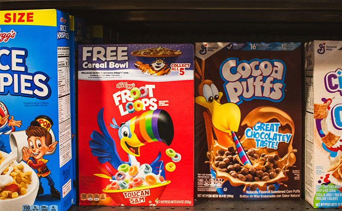Cereal aisle featuring Froot Loops and Cocoa Puffs boxes, highlighting crazy coincidences in packaging designs.
