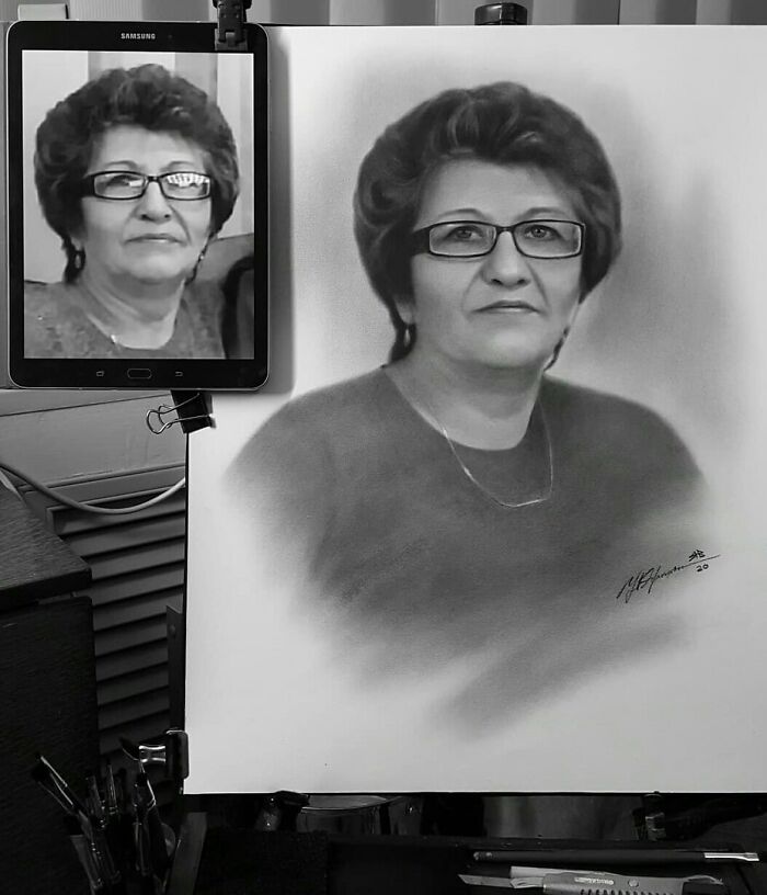 Hyper-realistic pencil portrait of a woman, showing a side-by-side of the drawing and the reference photo on a tablet.