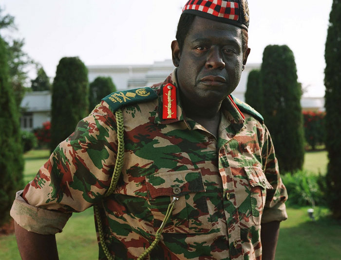 Actor in camouflage military uniform posing seriously, showcasing dedication in challenging and difficult roles for acting career.