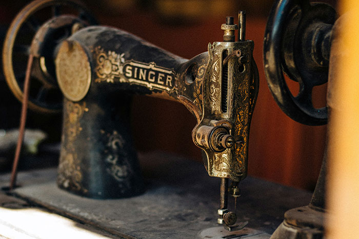 Vintage sewing machine with ornate designs, showcasing once-normal technology that might shock people in 2025.