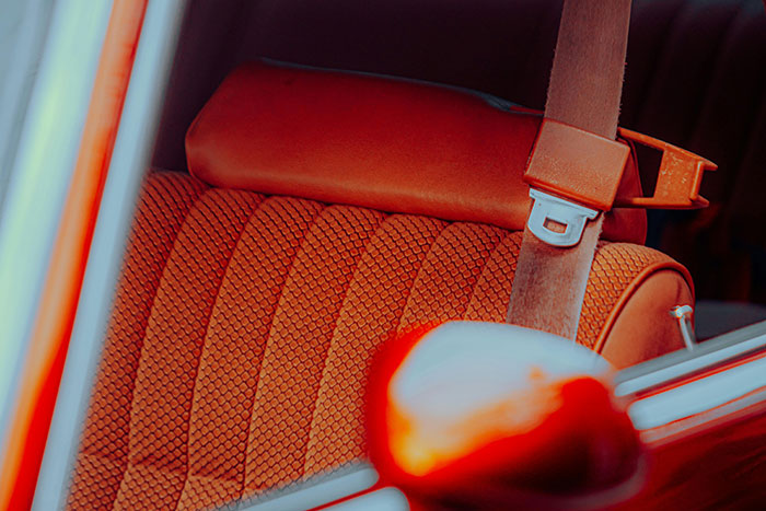 Vintage car seat with a patterned fabric, showcasing retro design that might surprise in 2025.