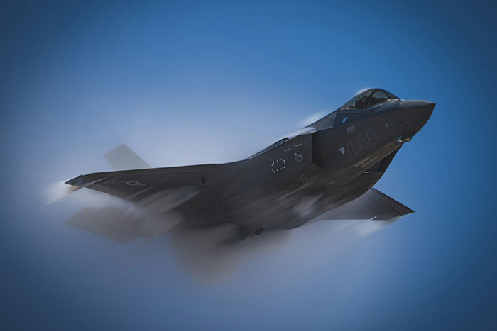 Fighter jet soaring through the sky, symbolizing advancements normal in 2025 technology.