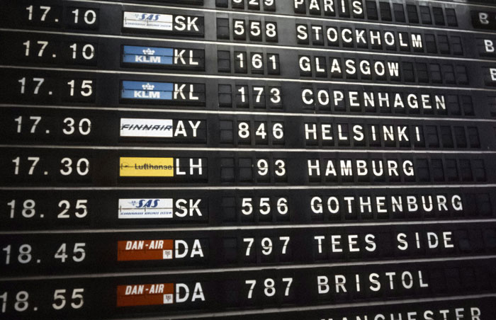 Flight departure board showing destinations like Paris and Stockholm, representing affordable flights insight.