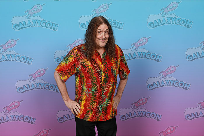 Person at GalaxyCon in a colorful shirt, posing for a fun facts feature.