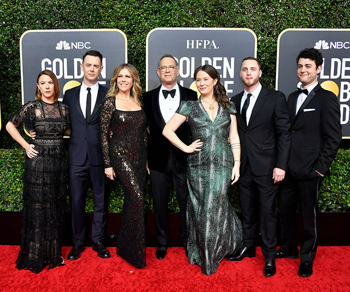 Group posing on the Golden Globes red carpet, highlighting childhood experiences.