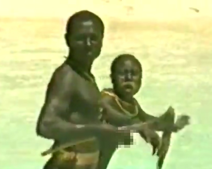 Indigenous tribe members in traditional setting, related to YouTuber stunt risking isolation.