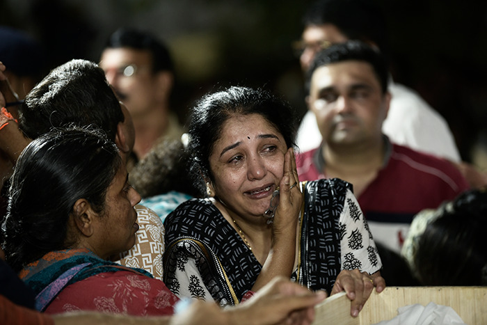 Family members mourning with grief and tears as horrifying viral video of mass tragedy killing 26 lives spreads online.