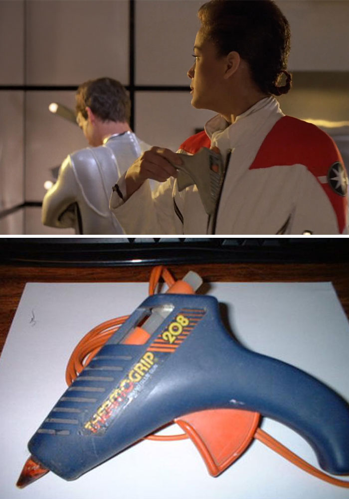 Actors in sci-fi costumes with a retro grip 208 glue gun used creatively as a prop in the scene.