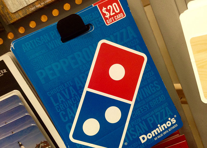 Domino's $20 gift card on display, featuring a vibrant blue and red design, symbolizing marriage hacks creativity.