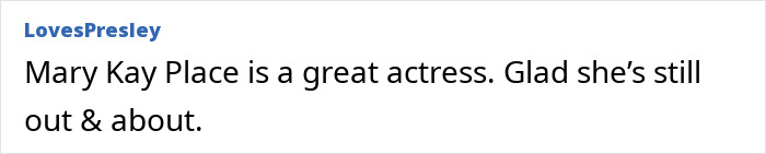 Mary Kay Place walking casually on the street, wearing a casual outfit, blending in with an unrecognizable appearance.