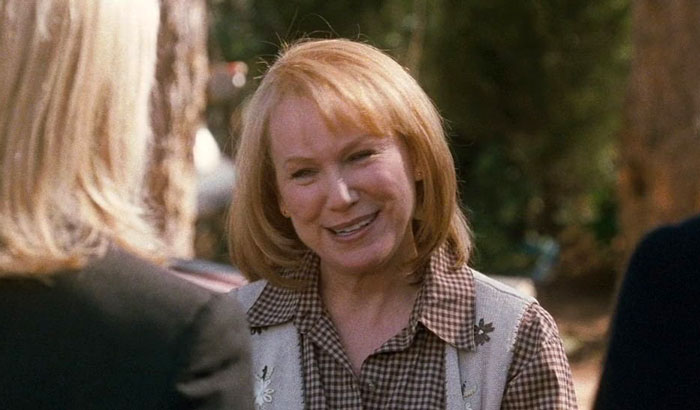 Mary Kay Place casually strolling in a checked shirt, her appearance surprising many fans.