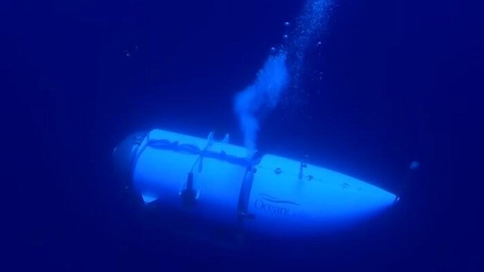 A submarine exploring deep ocean waters, emitting bubbles.