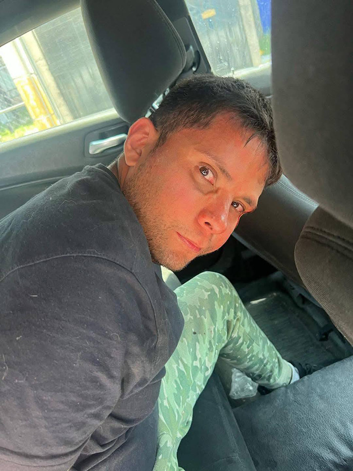 Man in casual attire sitting in a car, related to vigilante justice story. Man in casual attire sitting in a car, related to vigilante justice story.