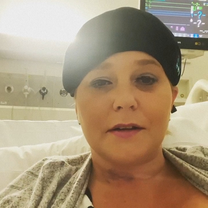 Woman in hospital bed wearing black headscarf with medical monitor in the background, related to Virginia Giuffre tragic final note Woman in hospital bed wearing black headscarf with medical monitor in the background, related to Virginia Giuffre tragic final note