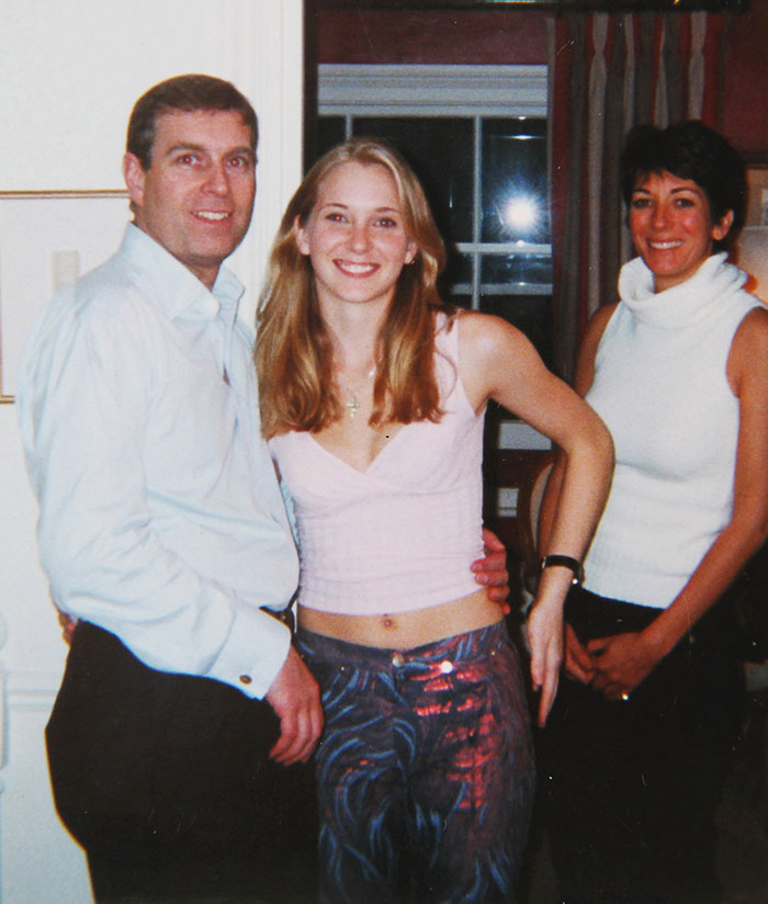 Three people posing together indoors amidst controversy surrounding Prince Andrew's accuser.